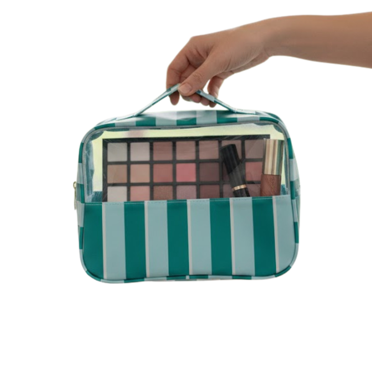 Hand holding a teal striped clear-front cosmetic bag filled with an eyeshadow palette and makeup