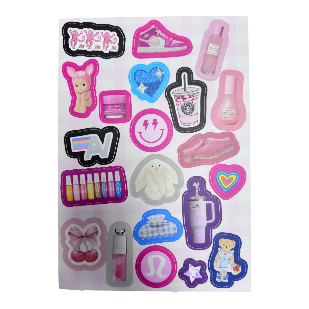 Pastel Day Dreams sticker sheet with pink, purple, and blue designs including sneakers, nail polish, sequined heart, coffee cup, smiley face, stuffed animals, and beauty items arranged on white background