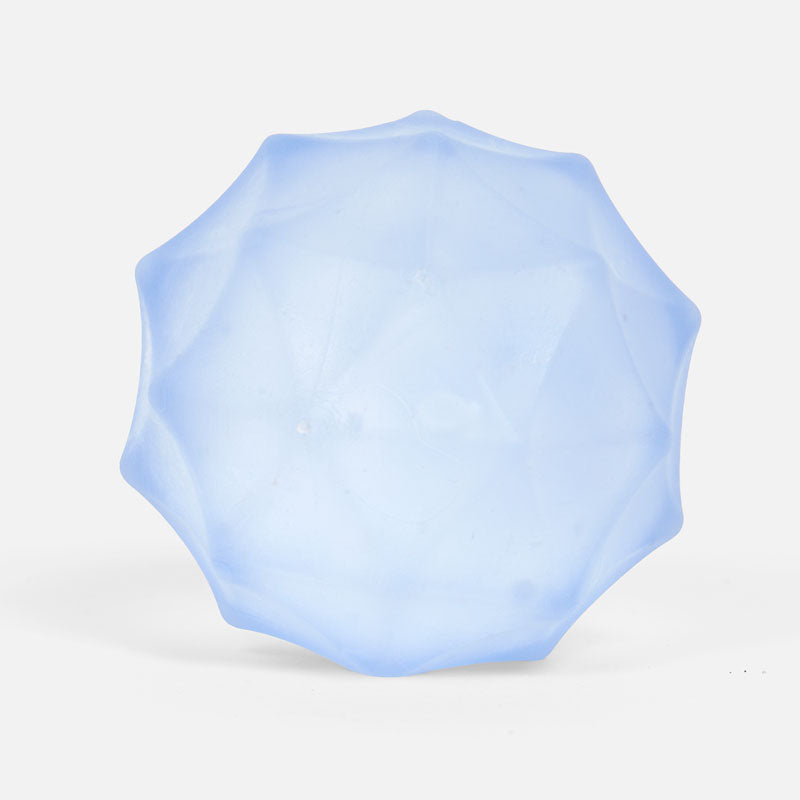 SPEKS Gump Surface Toy stress ball in light blue with a faceted gem-like shape
