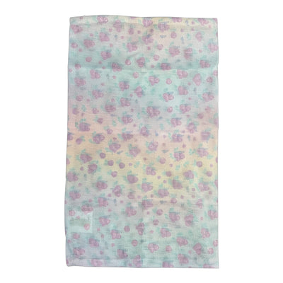 Mesh sock bag with a pastel rainbow tie-dye and small purple blossoms