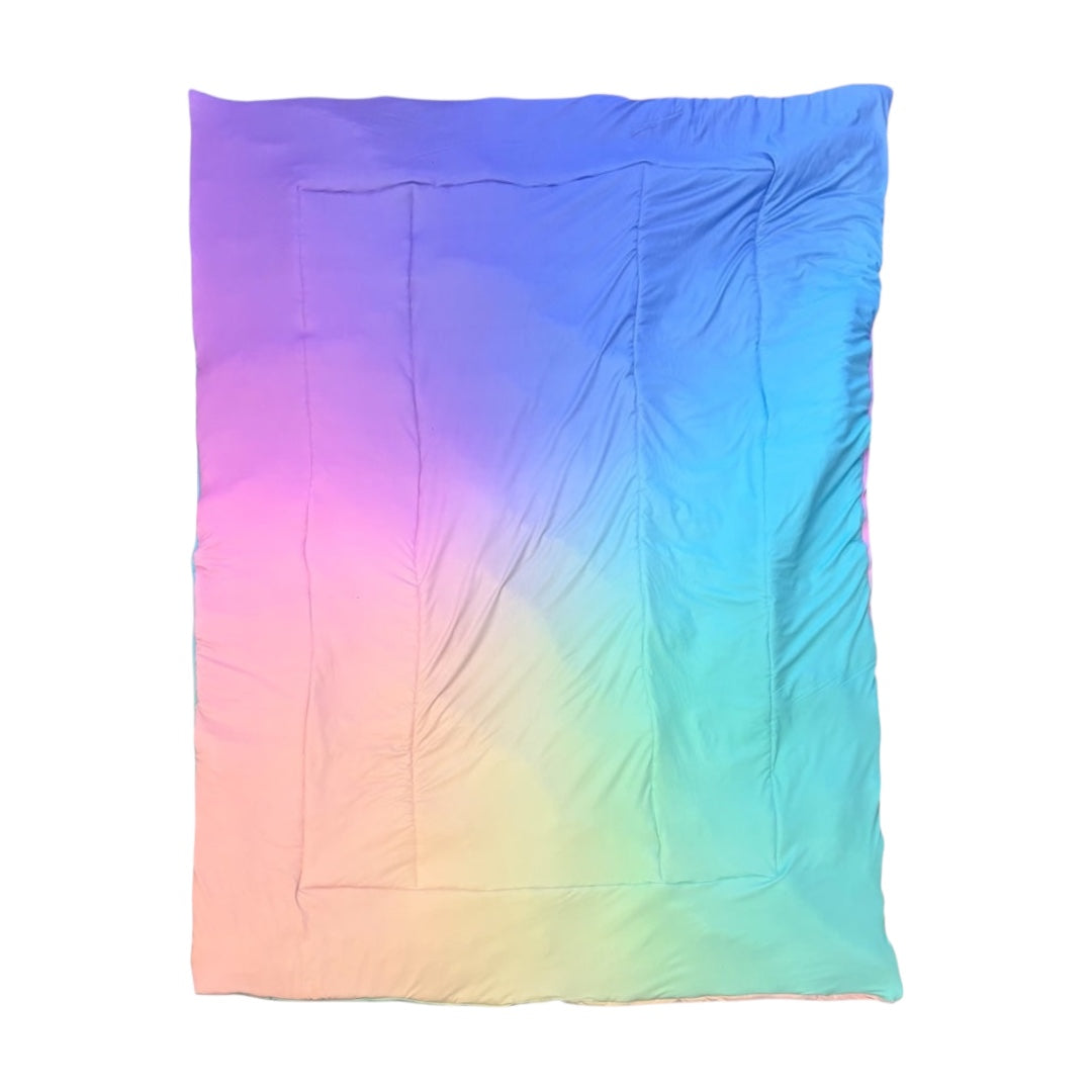 Pastel Dreams camp comforter laid flat in rainbow pastel ombre with pink, blue, green and yellow