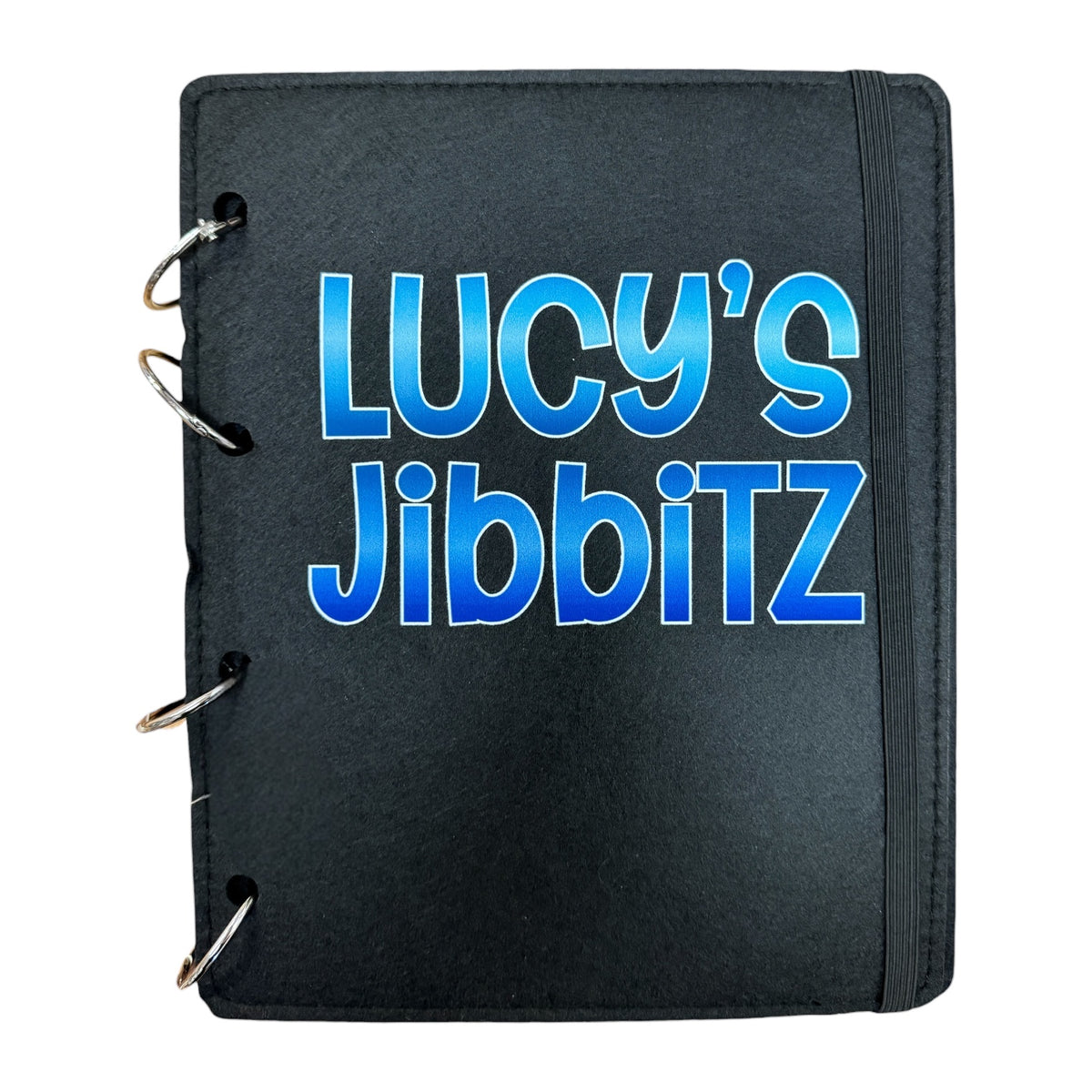 Black notebook with 'Lucy's Jibbitz' printed in blue on a white background