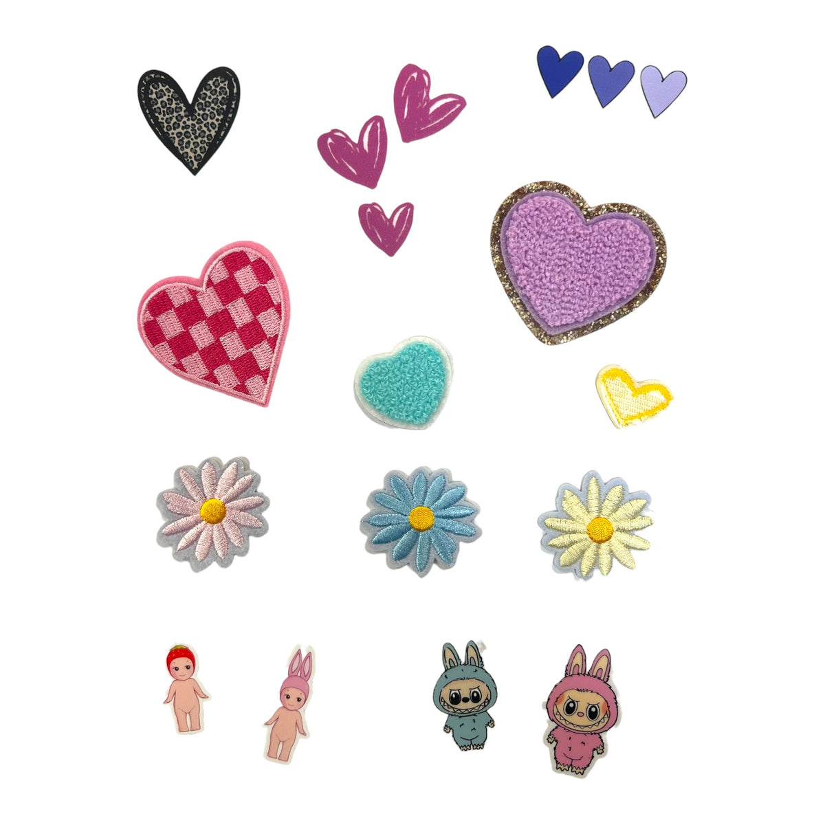 Sheet of heart, daisy, Sonny Angel and bunny character hat patches in pink, blue, purple and yellow