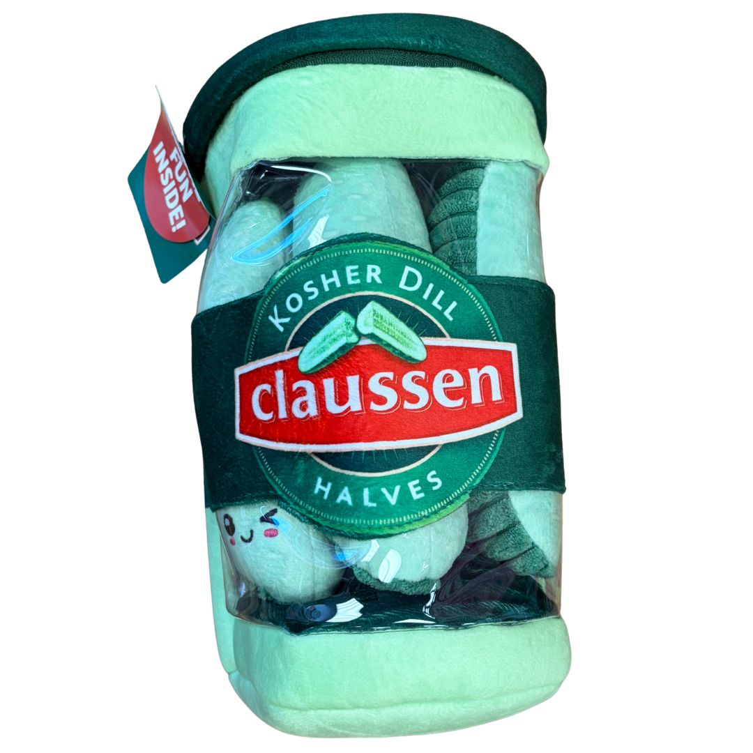 Claussen Kosher Dill Halves plush pickle jar with light green fabric body, dark green lid, product label with pickle graphics, and small smiley-faced pickle plushies visible inside clear window