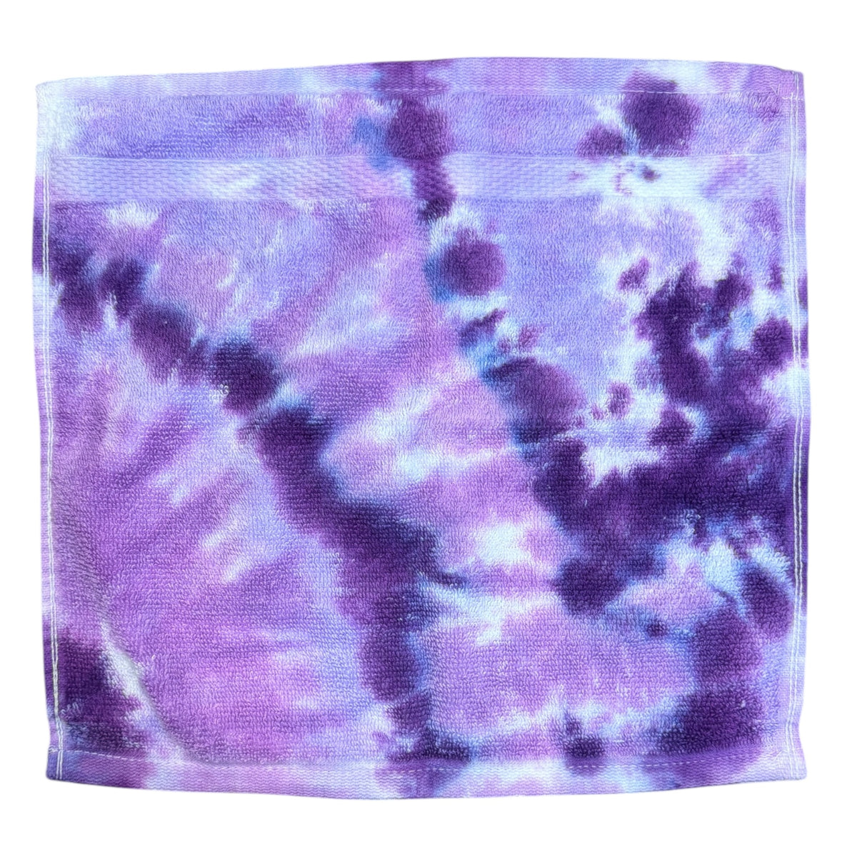 Cassidy Tie Dye Terry Washcloth in purple and blue watercolor tie-dye pattern with soft cotton terry texture folded flat