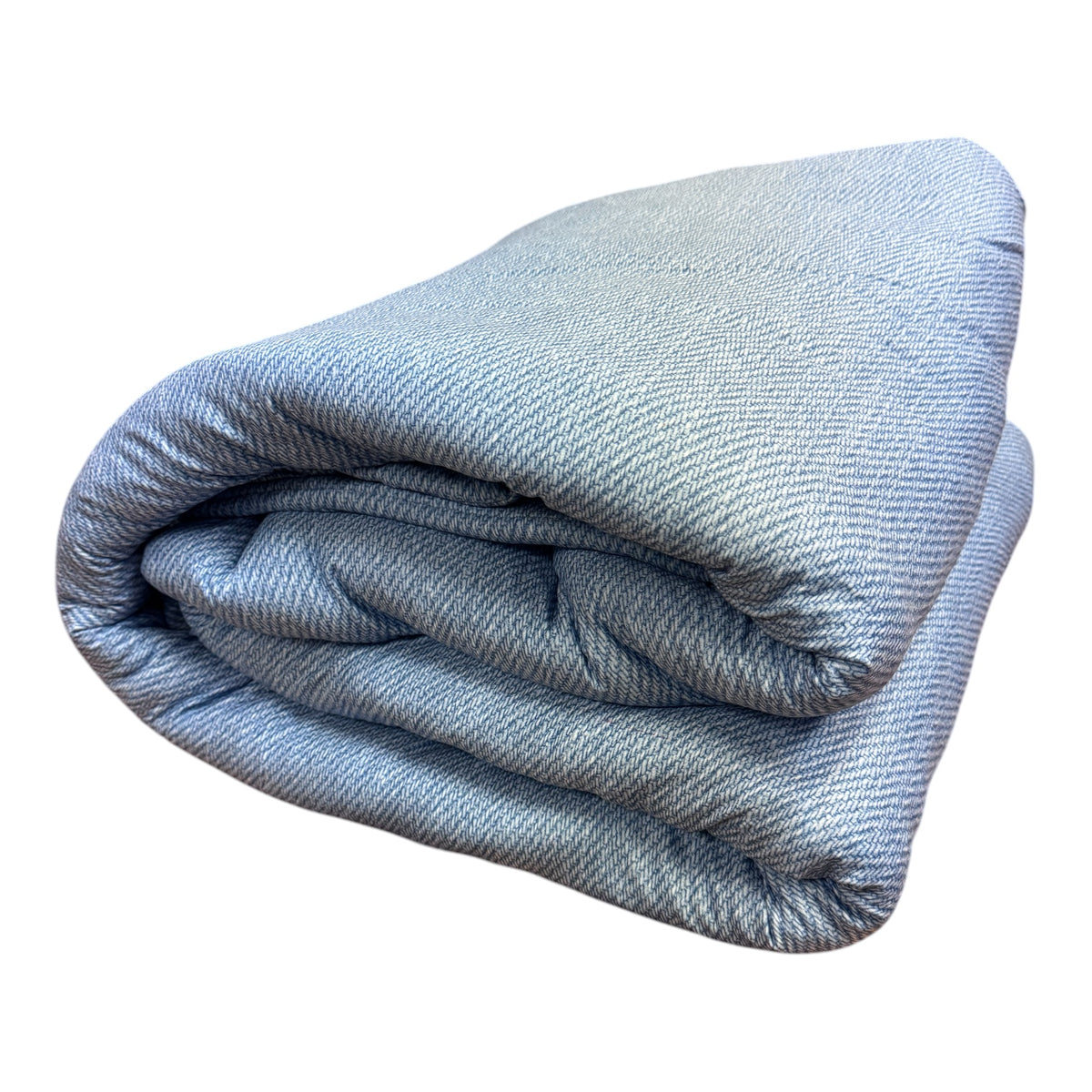 Tangled Up In Blue denim-inspired camp comforter rolled and displayed showing light blue textured fabric with darker blue tonal pattern