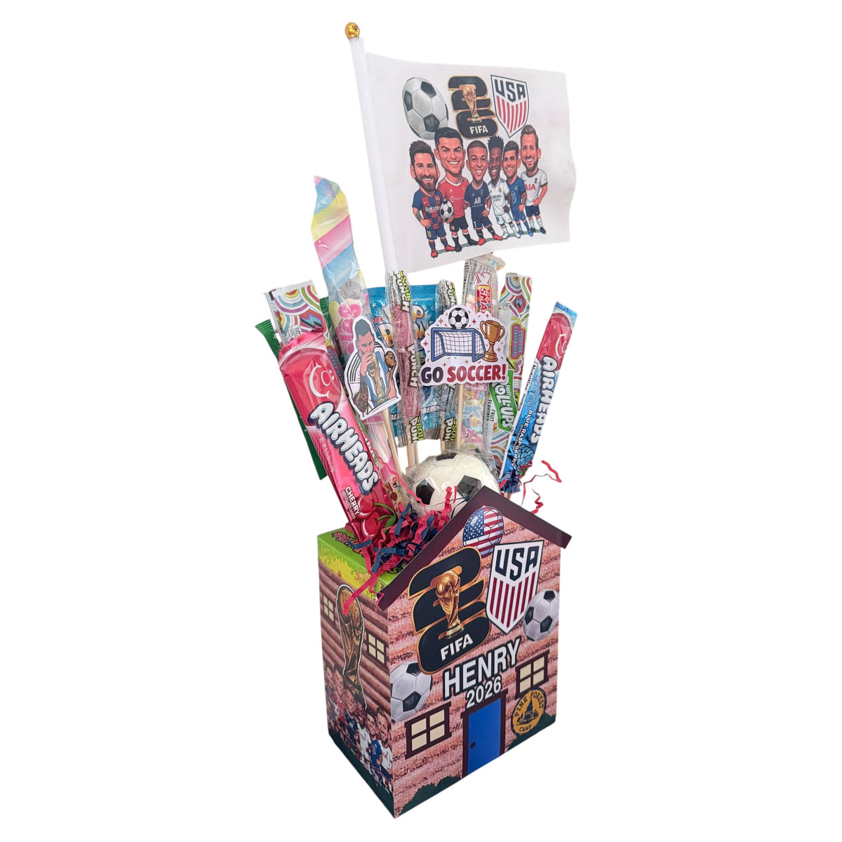Side angle of personalized World Cup soccer candy cabin with FIFA emblems, USA shield, soccer balls, candy necklaces, lollipops, and player flag display