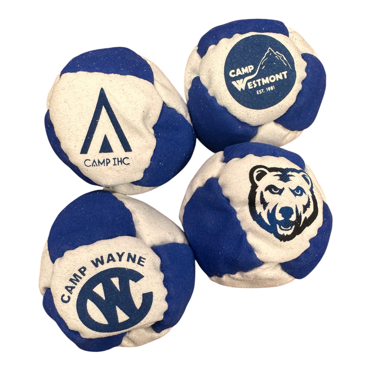 Close-up of Camp Westmont hacky sack in blue and white with mountain logo and EST. 1961 text