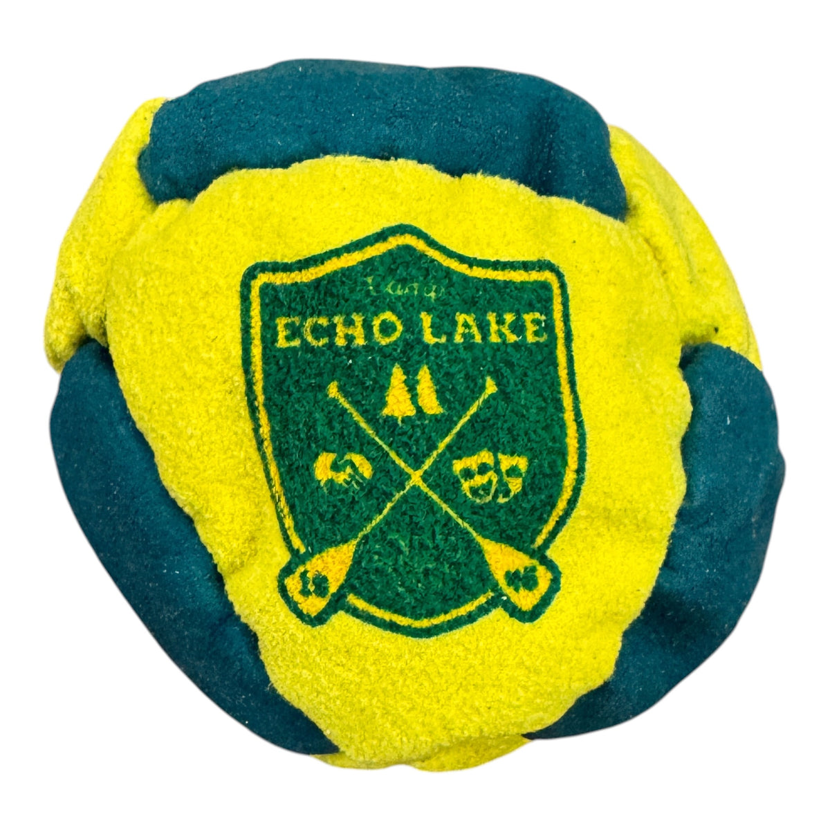 Close-up of Camp Chen-A-Wanda hacky sack in red, orange and yellow with sunset canoe design
