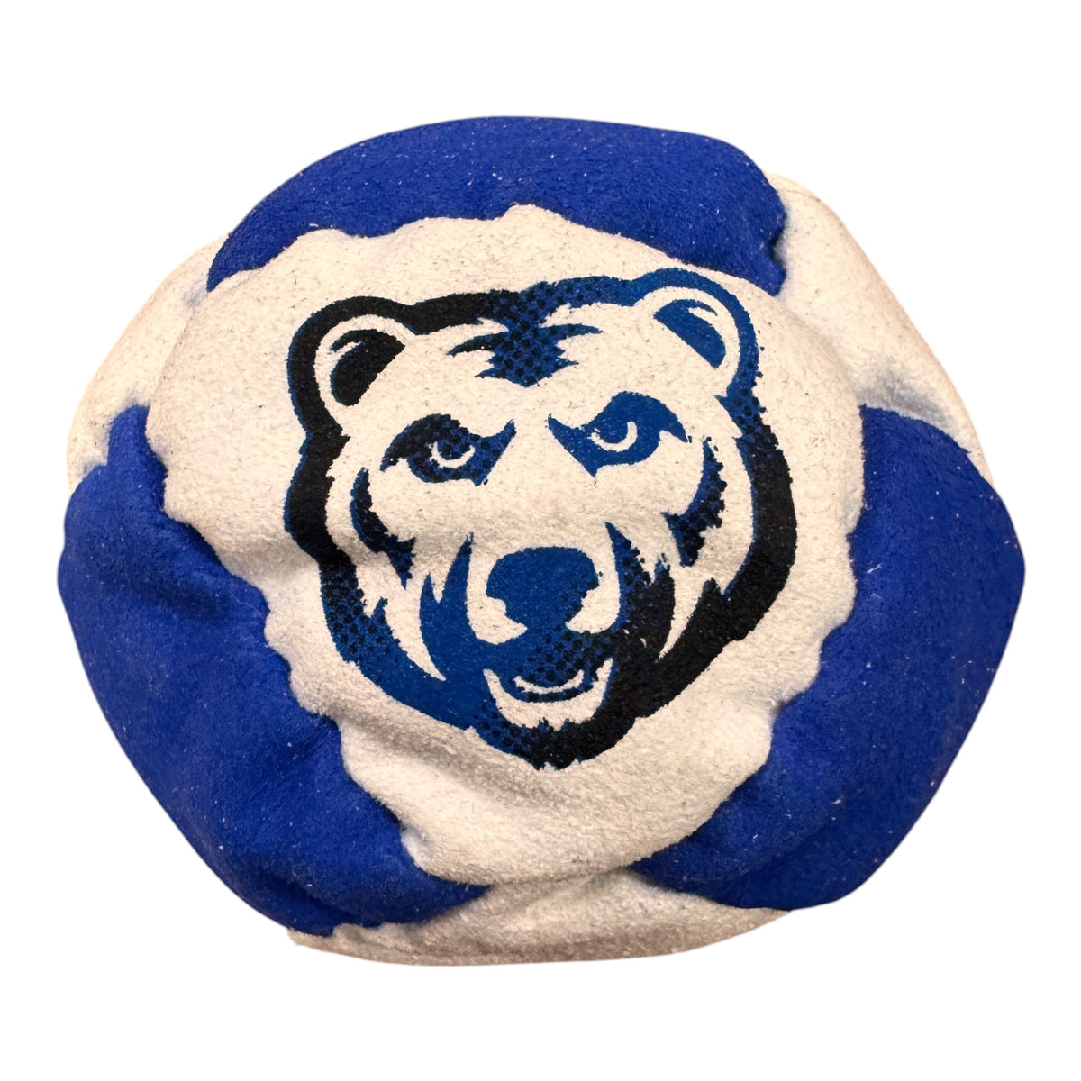 Close-up of Trail's End camp hacky sack in green and beige with Native American headdress logo and EST. 1947 text