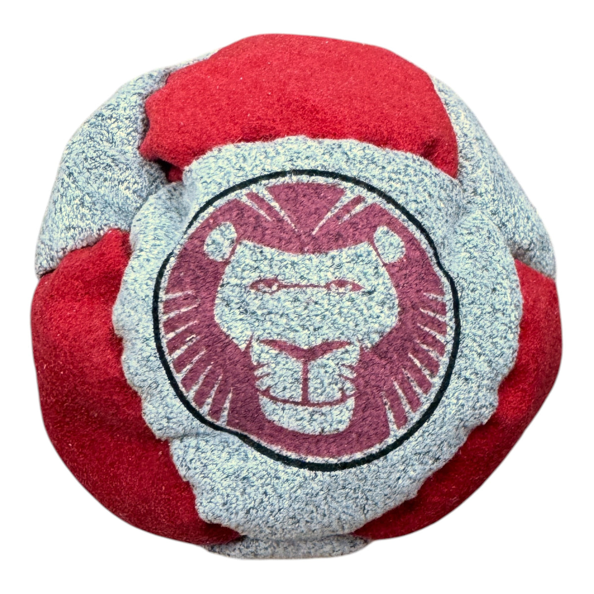 Close-up of Chippewa camp hacky sack in red and grey with lion mascot logo