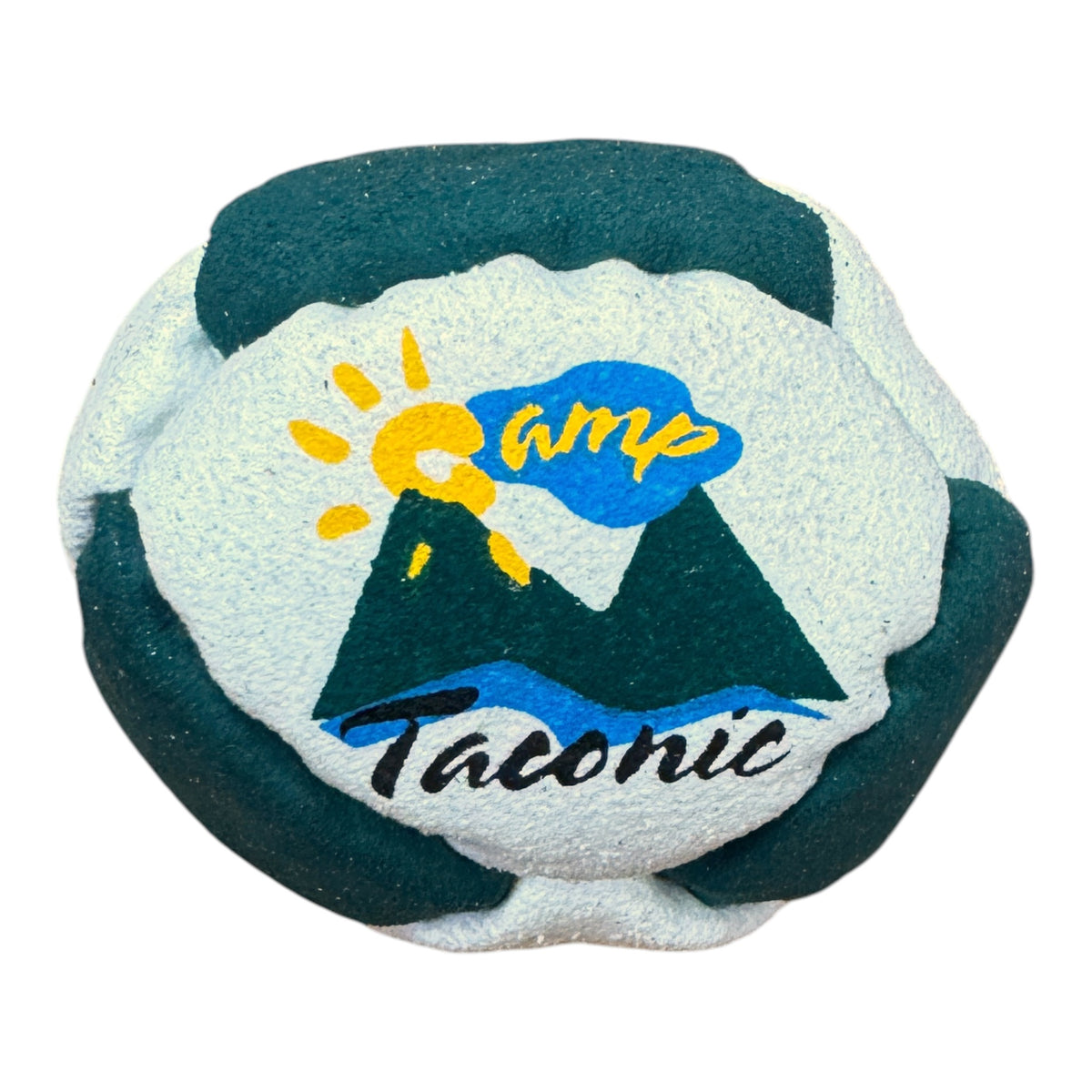 Close-up of Camp Taconic hacky sack in green and beige with sun logo and mountain design
