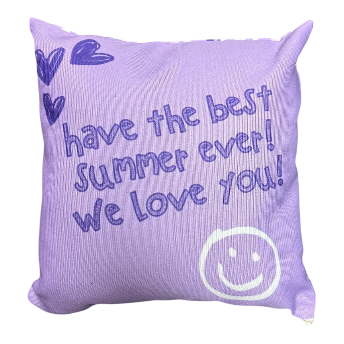 Purple personalized note pillow back with handwritten text 'have the best summer ever we love you' and smiley face for camp bunk