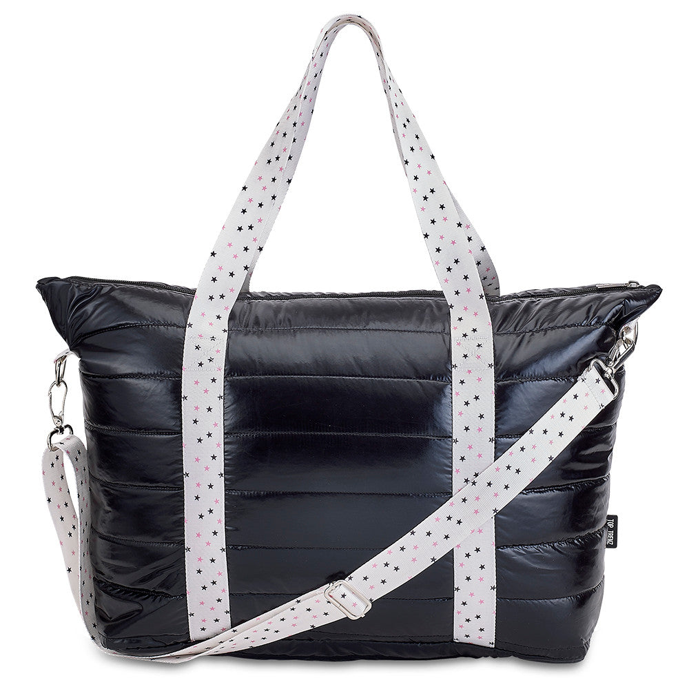 Black quilted puffer tote bag with white straps printed with tiny black and pink stars