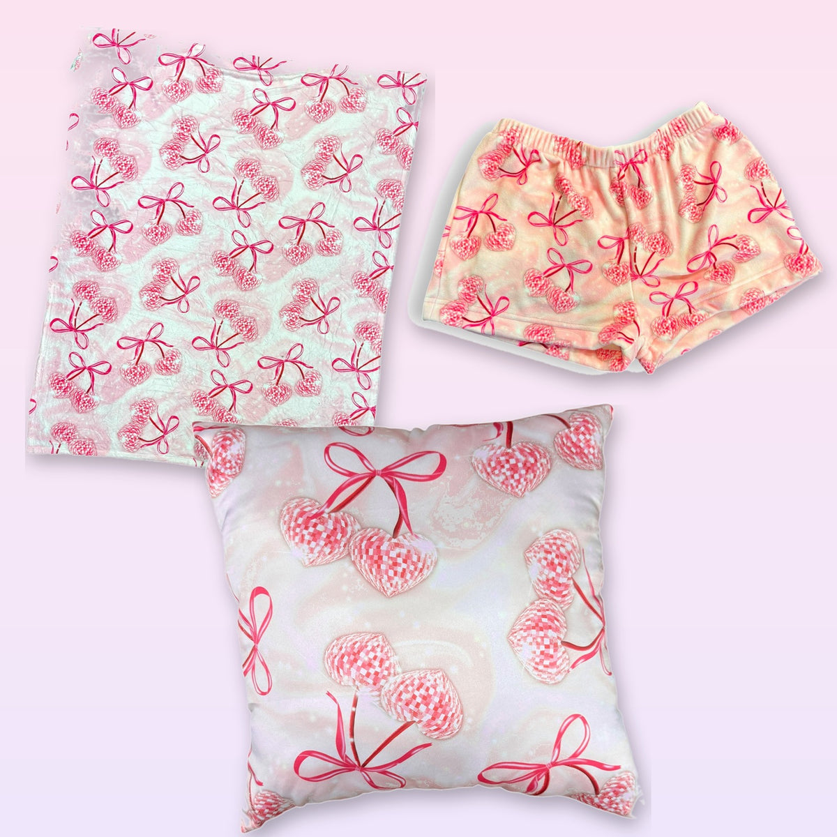 The cozy disco cherries bundle: fuzzy camp blanket, matching fuzzy shorts and an autograph pillow.