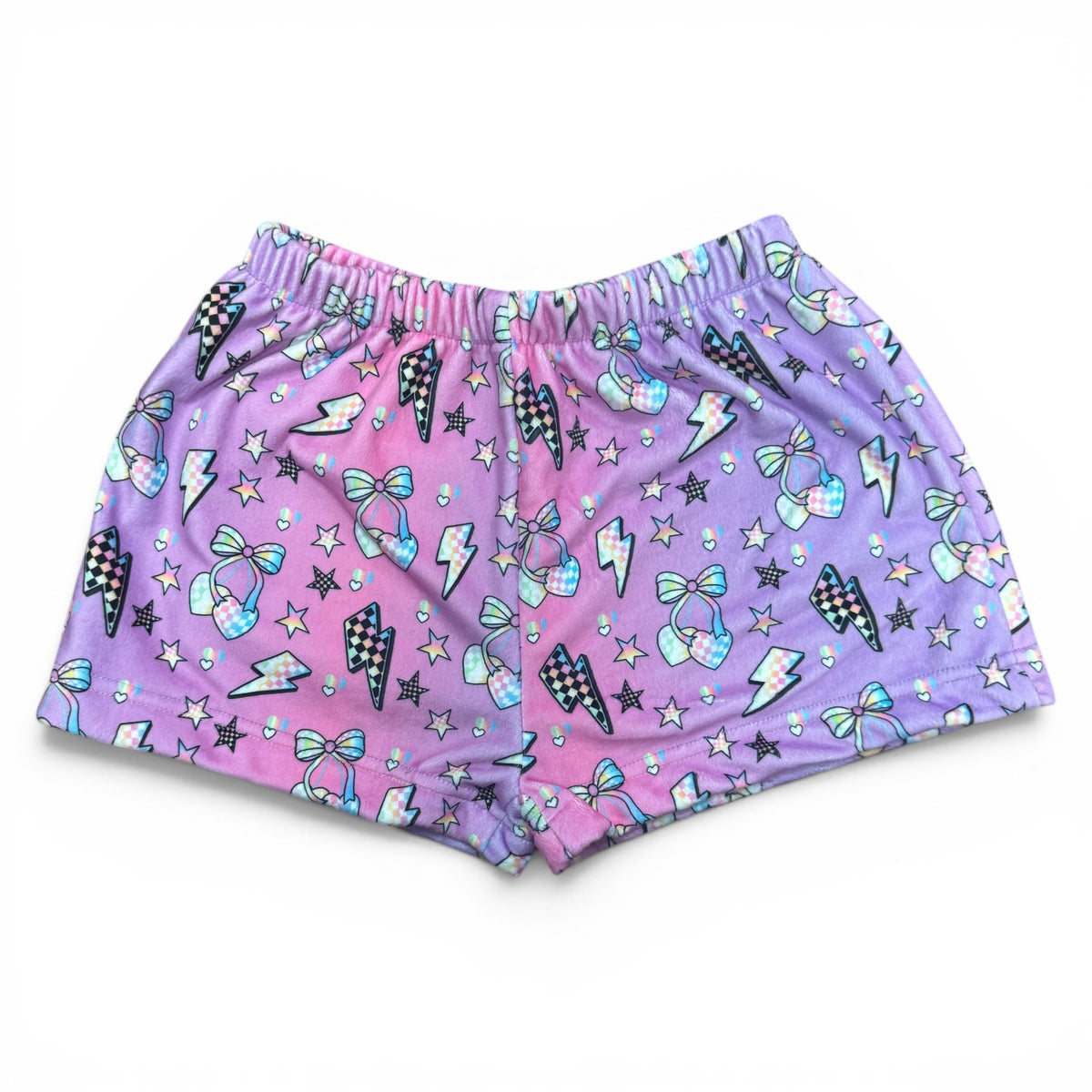 Electric Cherry Fuzzy Shorts in pink and purple ombre with checkered lightning bolts, cherries, stars and bows scattered across soft fuzzy fabric