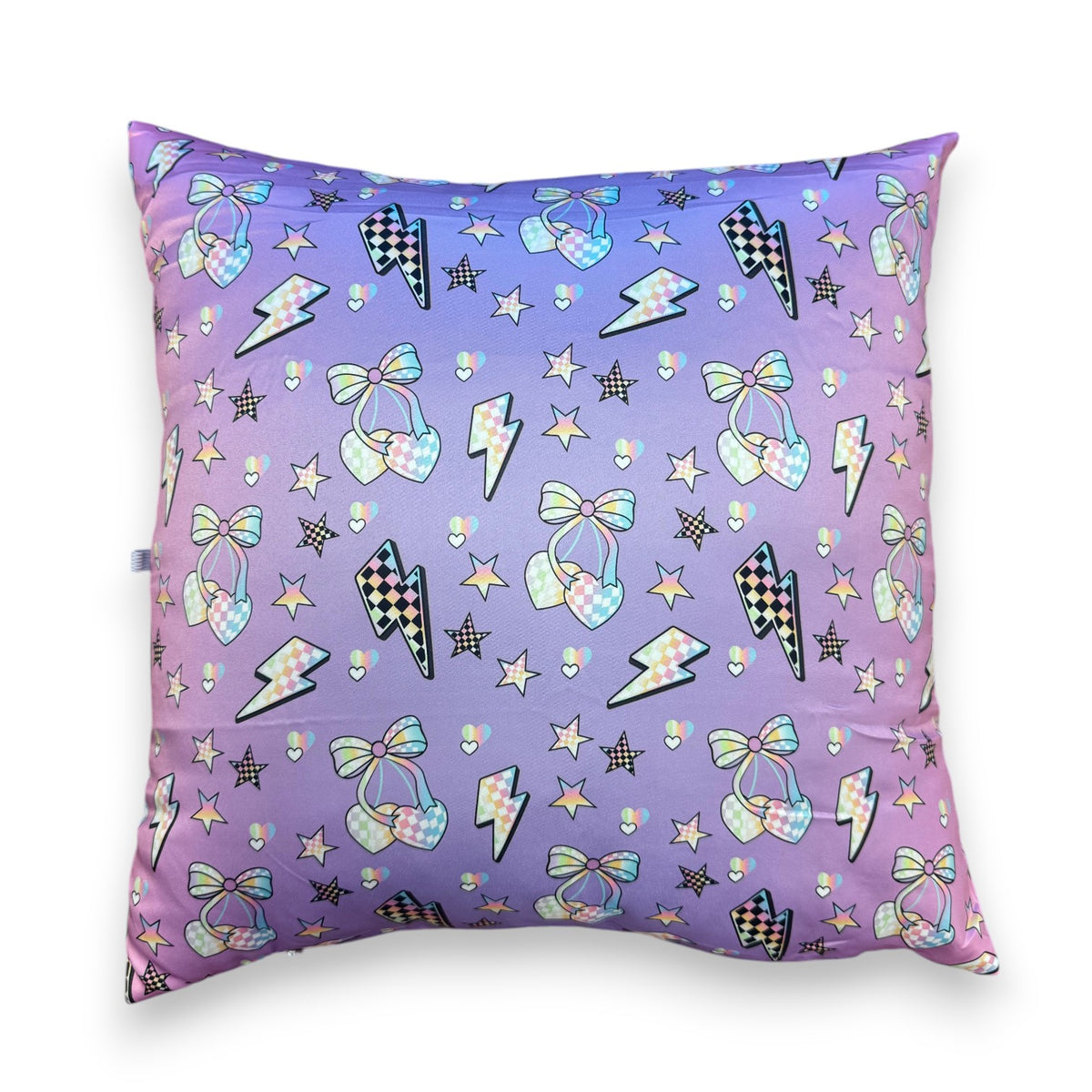 Electric Cherries autograph pillow in purple and pink gradient with hearts, bows, lightning bolts, and stars pattern